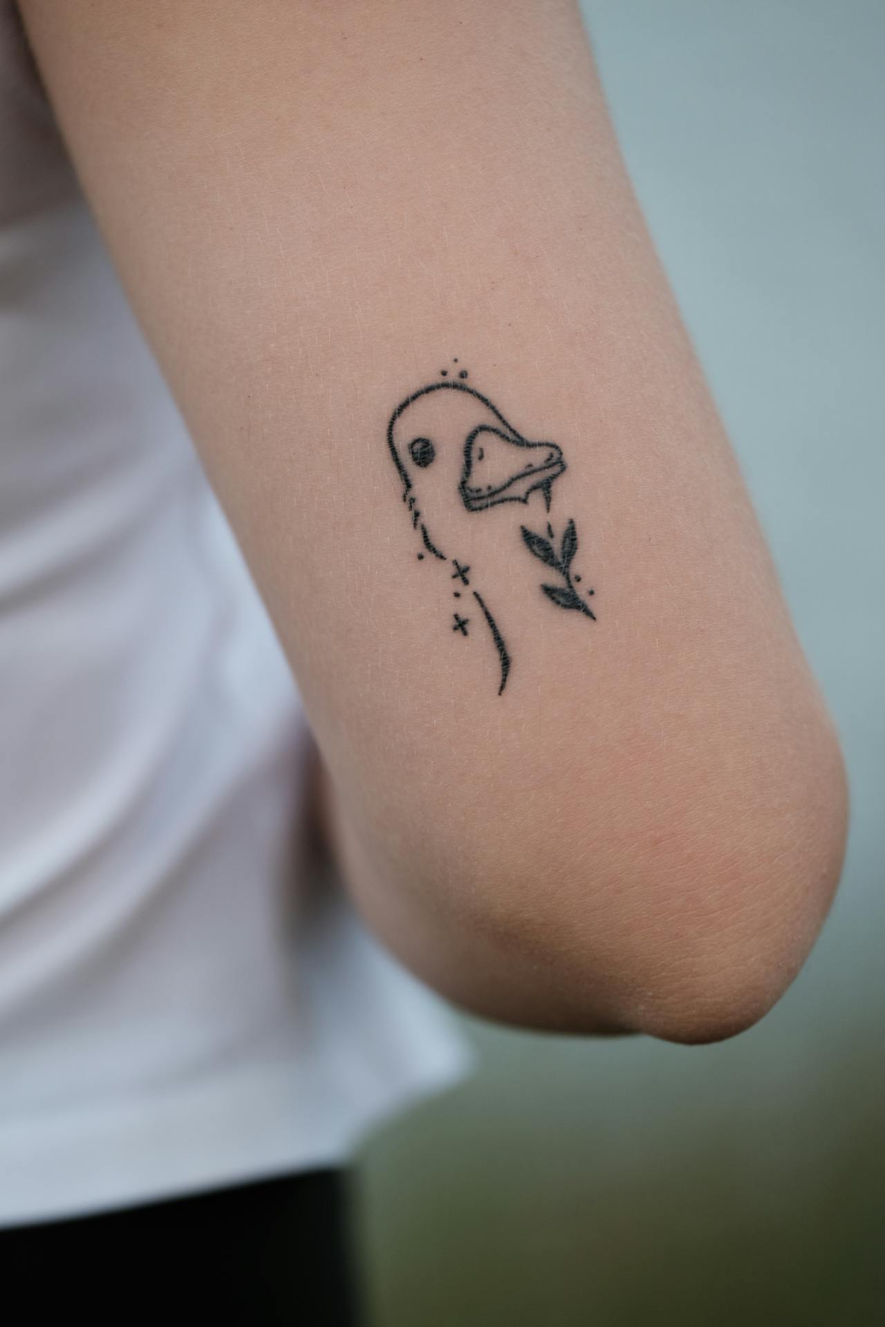 Fine-line tattoo by Morgan